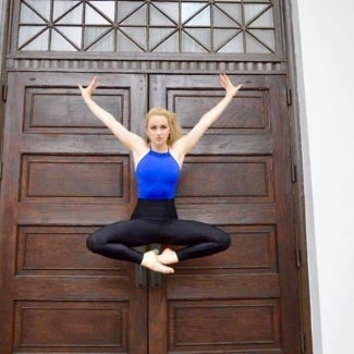 Student leaps into air before double doors