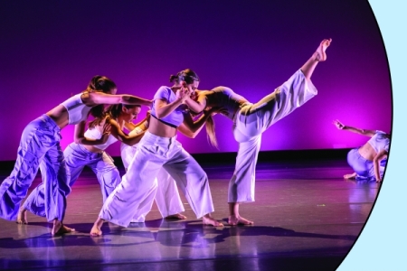 Performance from the Young Choreographers Series concert 2023; photo in a circle over a light blue background with a red spark.